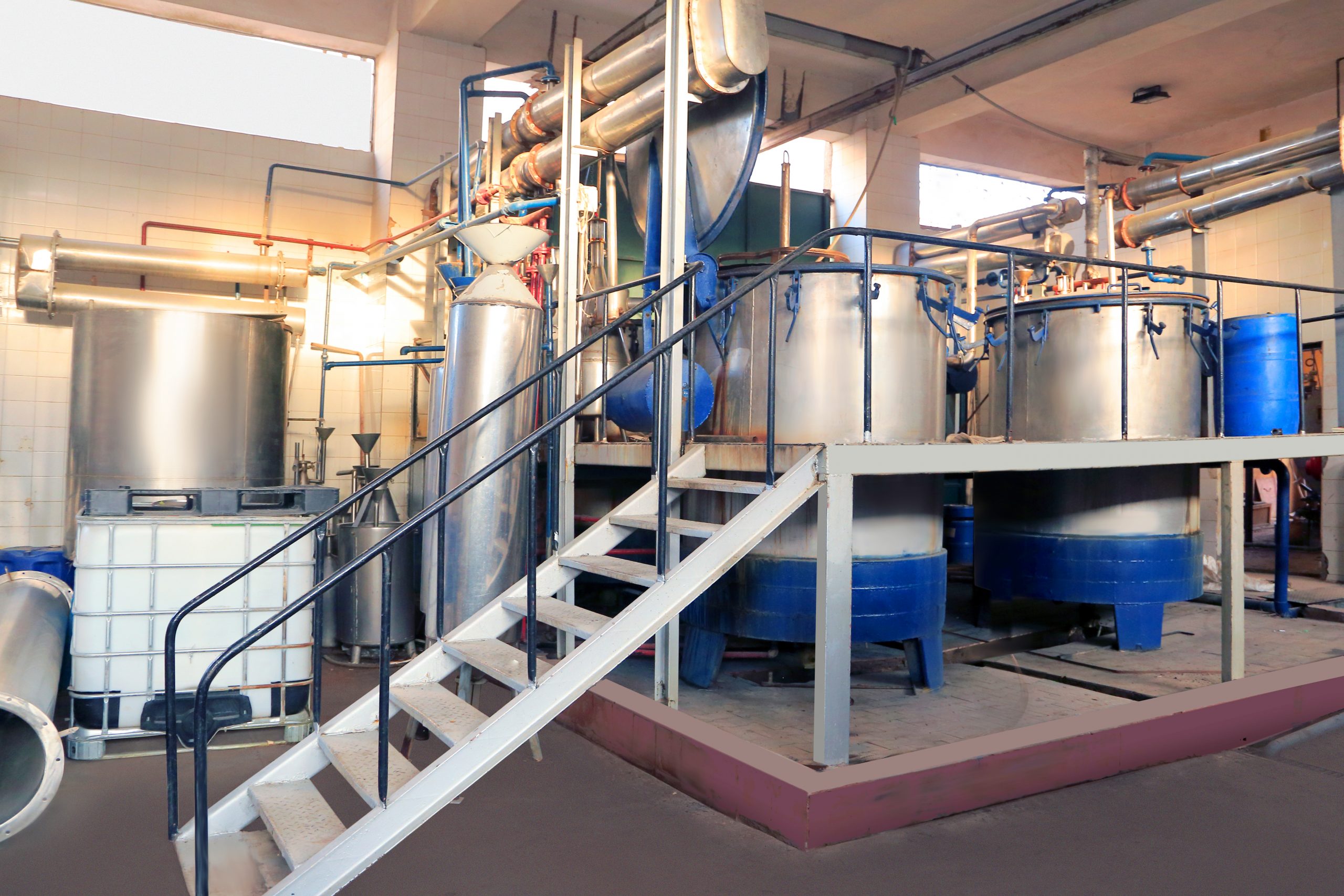 PHATRADE operator working at a distillation vessel